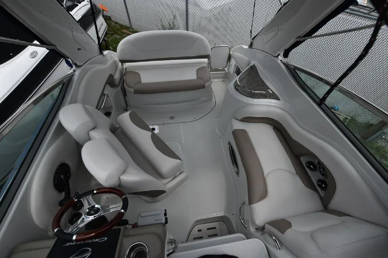 Slide: The Image of 2021 Crownline 264 CR boat interior with plush seating and modern design. - 8