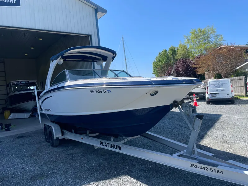 Slide: The Image of 2012 Chaparral 284 Sunesta boat on trailer outside storage facility. - 1