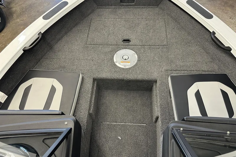 Slide: The Image of 2025 Crestliner 1850 Super Hawk boat interior with gray carpet and seating. - 3