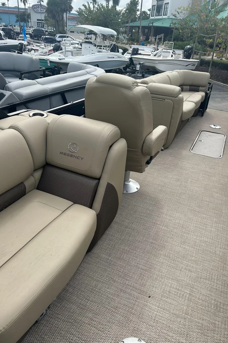 Slide: The Image of 2023 Regency 250 LE3 pontoon boat with luxurious seating. - 6