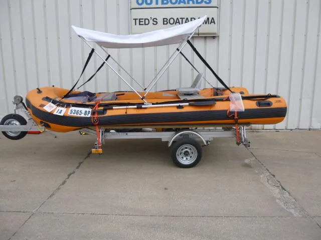 Slide: The Image of 2015 Sea Eagle 14' inflatable boat on trailer with canopy at Ted's Boatarama. - 12