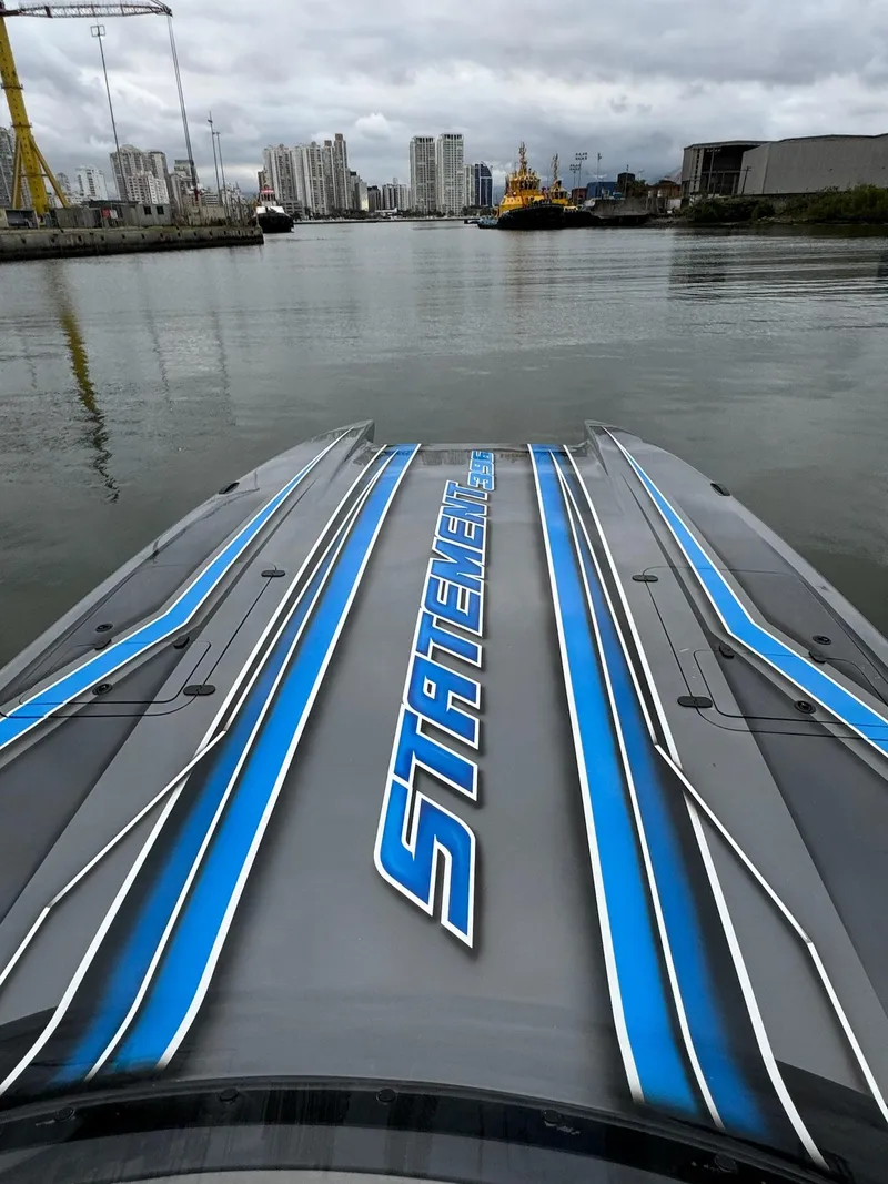 Slide: The Image of 2025 Statement 396 Cat powerboat on water with city skyline in background. - 11