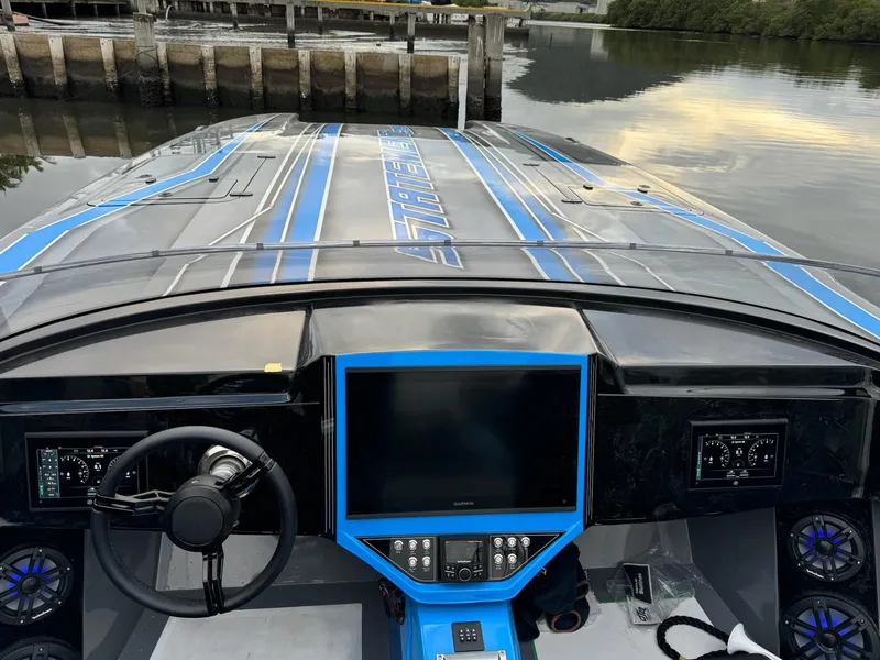 Slide: The Image of 2025 Statement 396 Cat boat dashboard with modern controls and sleek design. - 12