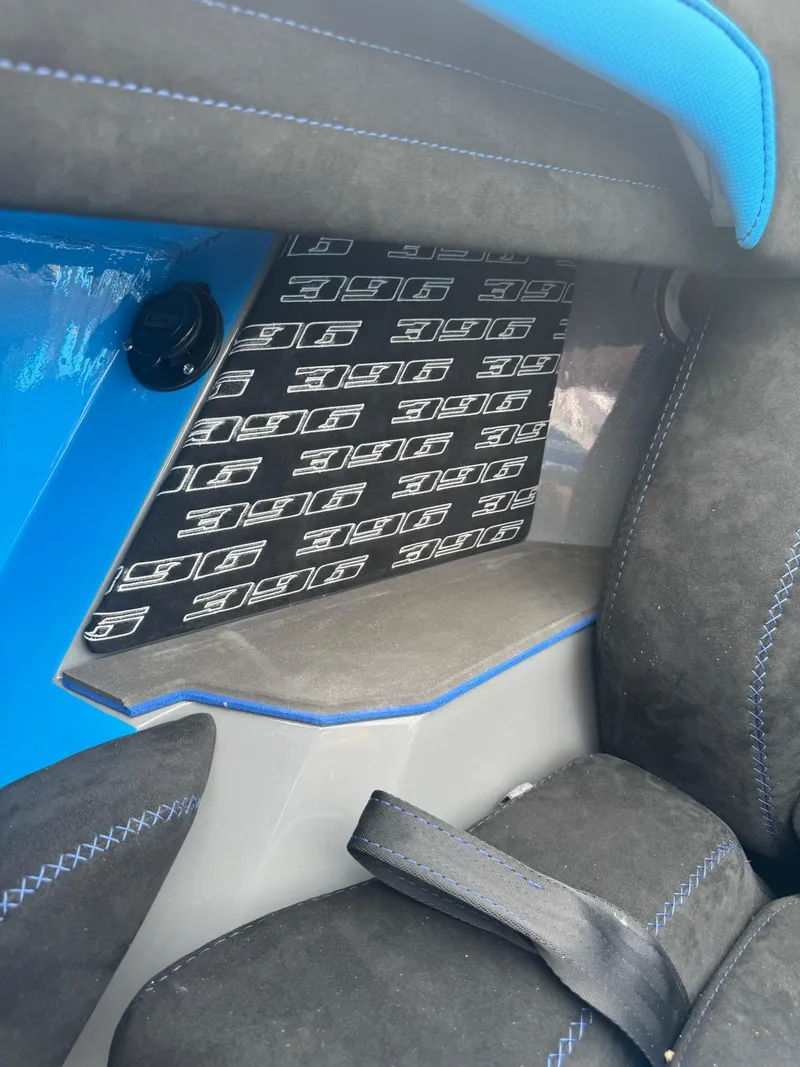 Slide: The Image of Interior of 2026 Statement 396 Cat with blue accents and logo detailing. - 17