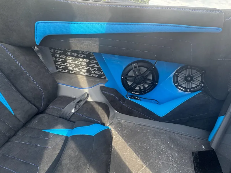 Slide: The Image of Interior of 2026 Statement 396 Cat with blue accents and audio speakers. - 18