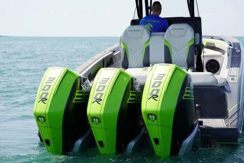 Slide: The Image of 2026 Statement 35 CC Open boat with triple green 300R engines on the water. - 1