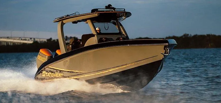 Slide: The Image of 2026 Statement 35 CC Open boat cruising on water at sunset. - 12