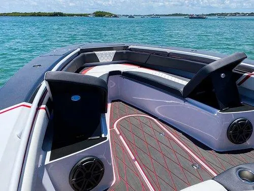 Slide: The Image of 2026 Statement 35 CC Open boat interior with sleek seating and modern design on a sunny day. - 13
