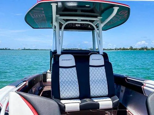 Slide: The Image of 2026 Statement 35 CC Open boat with stylish seating on clear blue water. - 16