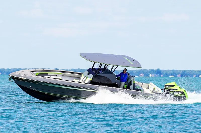 Slide: The Image of 2026 Statement 35 CC Open boat cruising on a clear blue lake. - 17