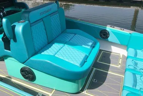 Slide: The Image of 2026 Statement 35 CC Open boat with turquoise seating and quilted design. - 20