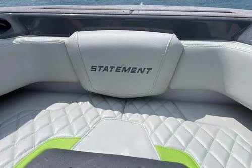 Slide: The Image of 2026 Statement 35 CC Open boat interior with quilted white and green seating. - 4