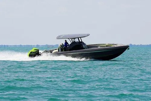 Slide: The Image of 2026 Statement 35 CC Open boat speeding on clear blue water. - 5