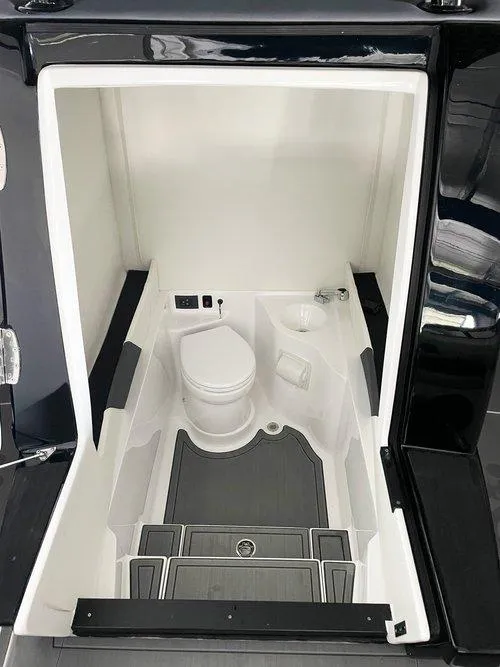 Slide: The Image of 2026 Statement 35 CC Open boat interior with compact marine toilet and sleek design. - 9