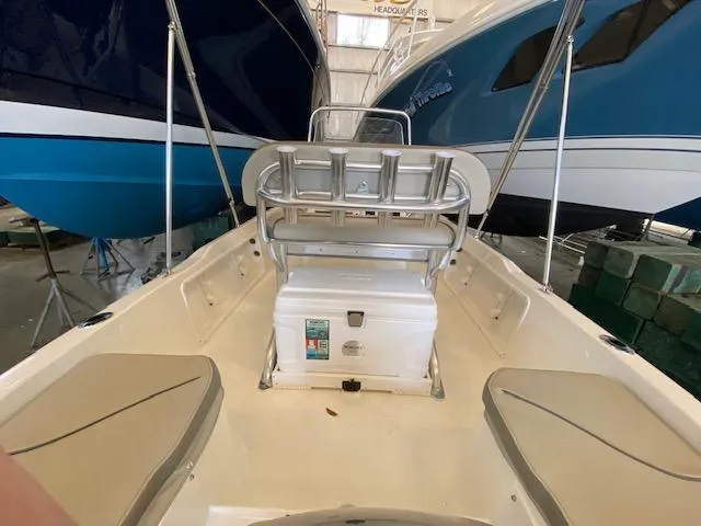 Slide: The Image of 2023 Key West 1720CC center console boat interior with seating and cooler. - 10