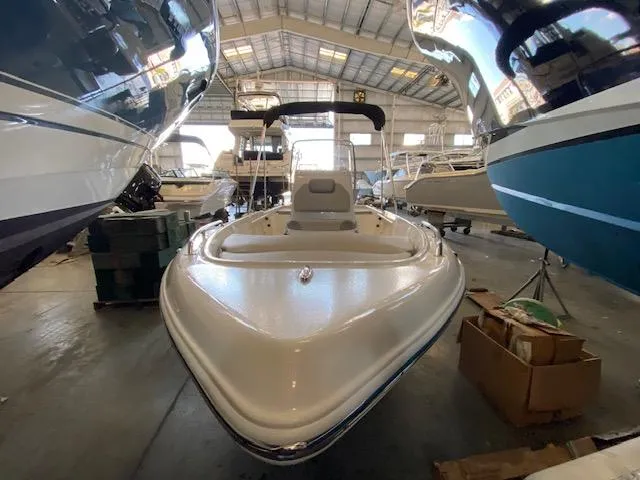 Slide: The Image of 2023 Key West 1720CC boat in a storage facility. - 2
