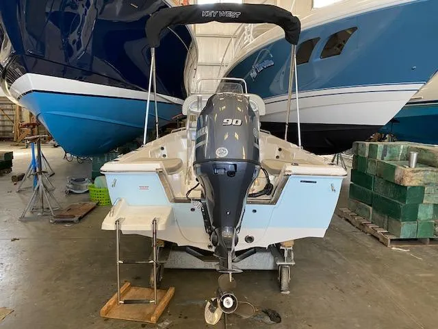 Slide: The Image of 2023 Key West 1720CC boat with 90 HP engine in storage. - 3