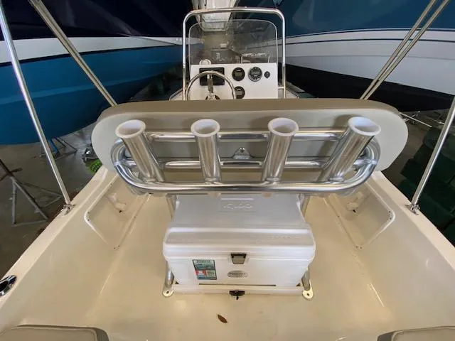 Slide: The Image of 2023 Key West 1720CC center console boat interior with rod holders and cooler. - 4