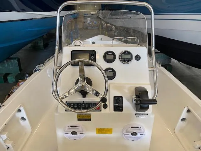 Slide: The Image of 2023 Key West 1720CC boat console with steering wheel and gauges. - 6