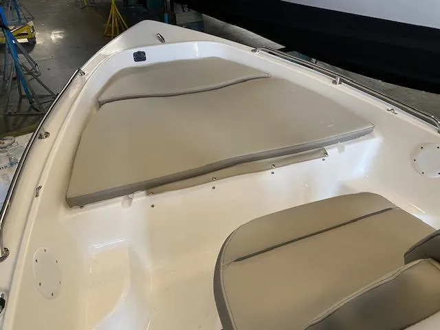 Slide: The Image of 2023 Key West 1720CC boat interior with cushioned seating. - 7