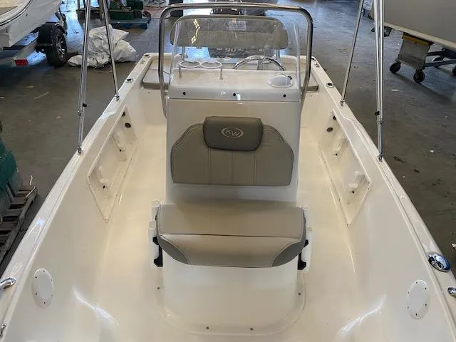 Slide: The Image of 2023 Key West 1720CC center console boat interior with seating and steering console. - 8
