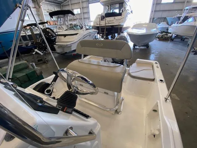 Slide: The Image of 2023 Key West 1720CC center console boat interior in a showroom. - 9