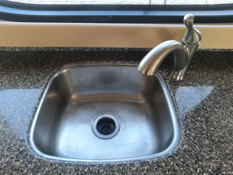 Slide: The Image of 2003 Meridian 341 Sedan kitchen sink with modern faucet. - 14