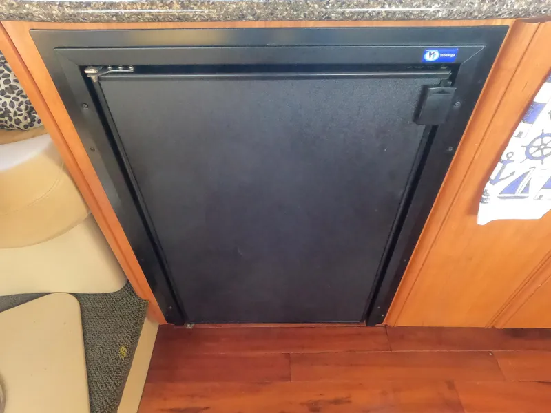 Slide: The Image of Black refrigerator in 2003 Meridian 341 Sedan yacht kitchen. - 15