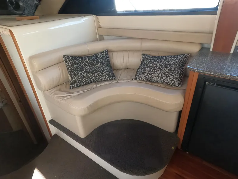 Slide: The Image of Luxurious interior seating of a 2003 Meridian 341 Sedan yacht with leopard print pillows. - 19