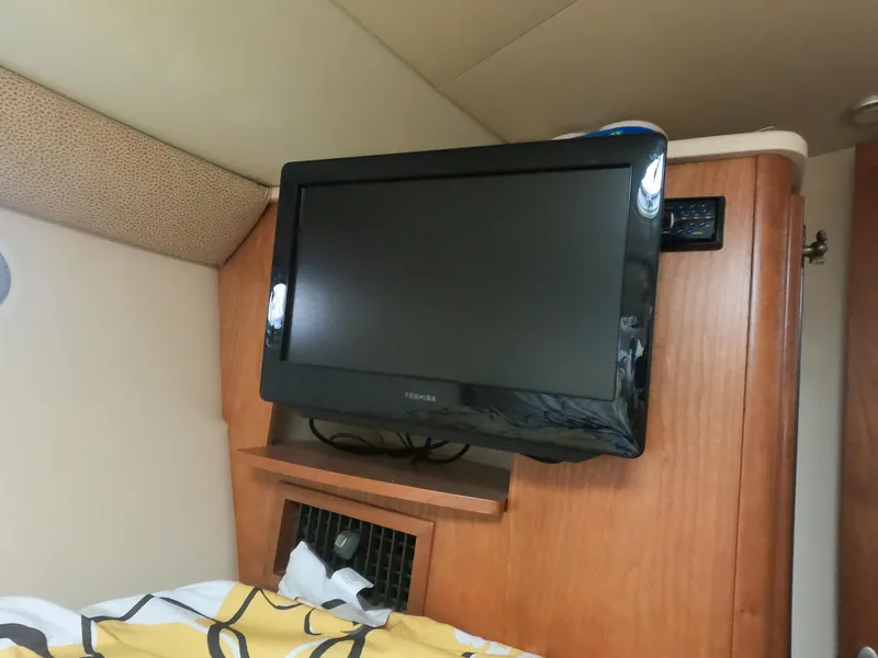 Slide: The Image of Flat-screen TV in the cabin of a 2003 Meridian 341 Sedan yacht. - 24