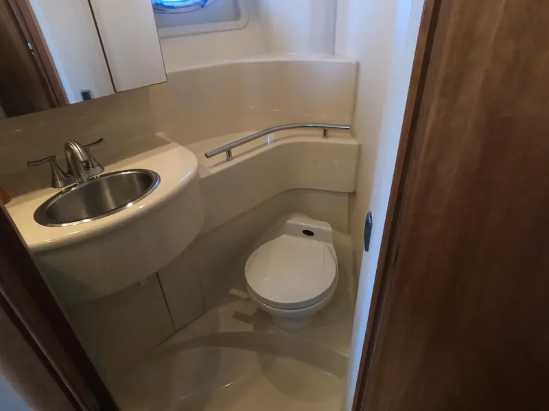 Slide: The Image of 2003 Meridian 341 Sedan bathroom with sink, toilet, and mirror. - 25