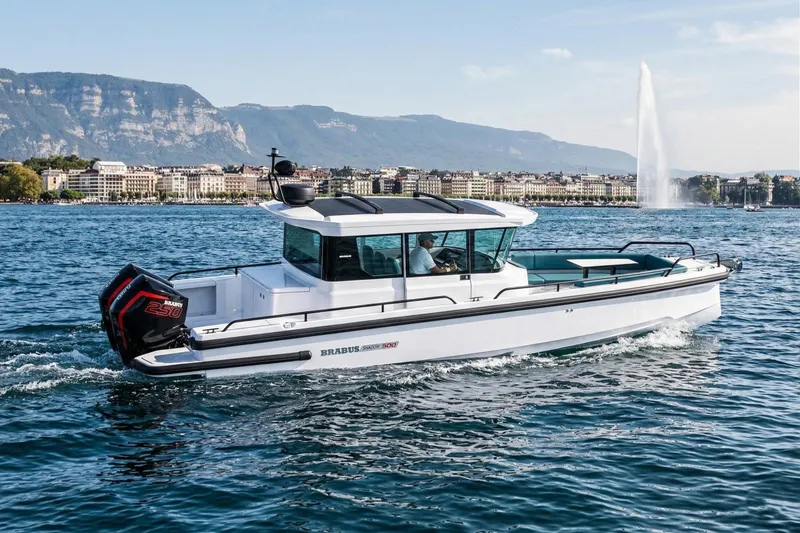 The Image of 2024 BRABUS Shadow 500 Cabin Wet Bar cruising on a scenic lake with mountains. - 0