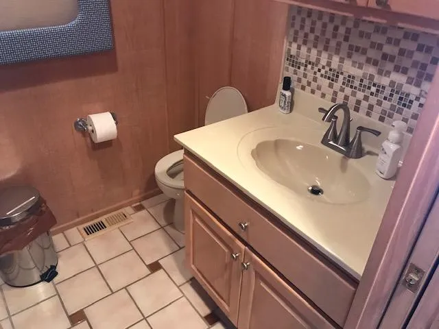 Slide: The Image of Bathroom interior of a 1997 Stardust Cruisers houseboat with sink and toilet. - 19