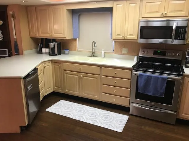 Slide: The Image of Modern kitchen in a 1997 Stardust Cruisers houseboat with stainless steel appliances. - 7