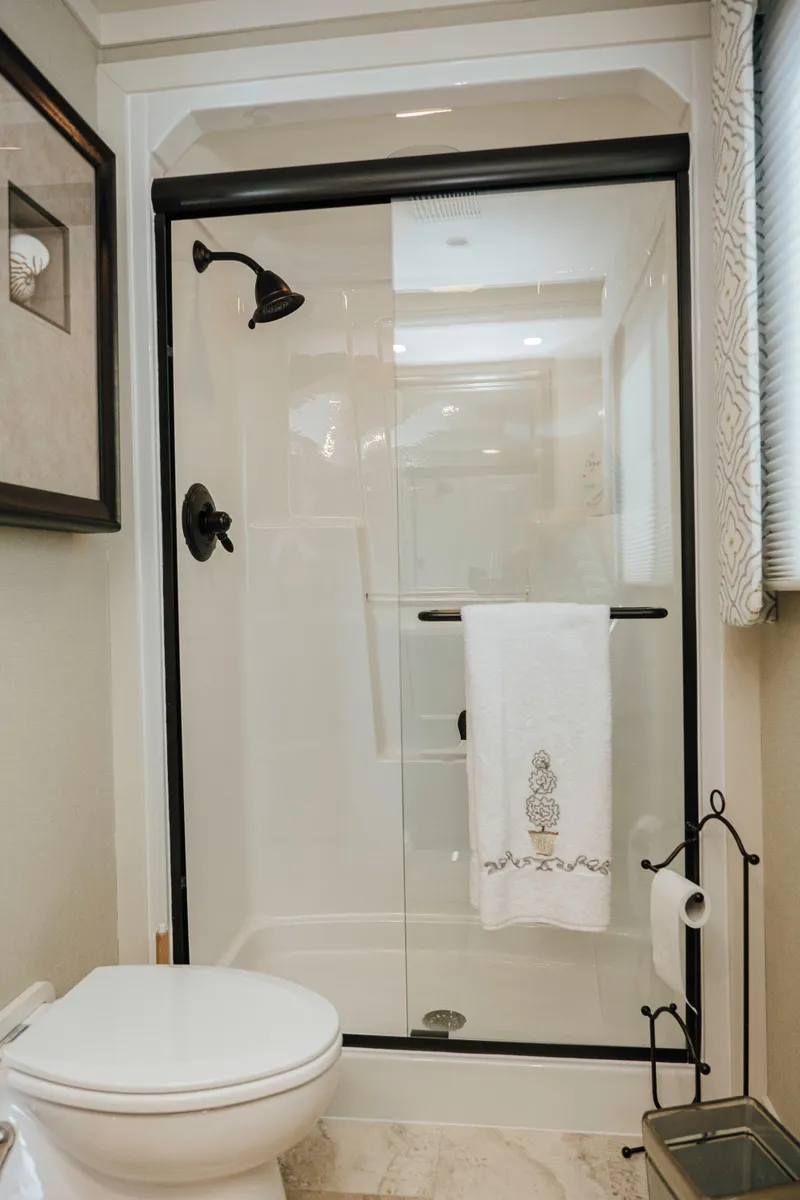 Slide: The Image of Modern bathroom in 1996 Sumerset houseboat with glass shower and elegant fixtures. - 11