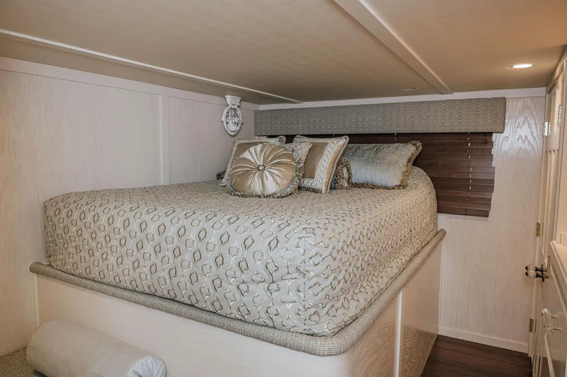 Slide: The Image of Luxurious bedroom interior of 1996 Sumerset houseboat with elegant bedding and decor. - 13