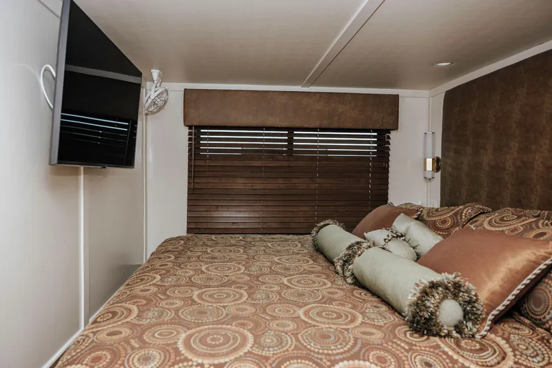 Slide: The Image of Luxurious bedroom interior of 1996 Sumerset Houseboat with TV and elegant bedding. - 14