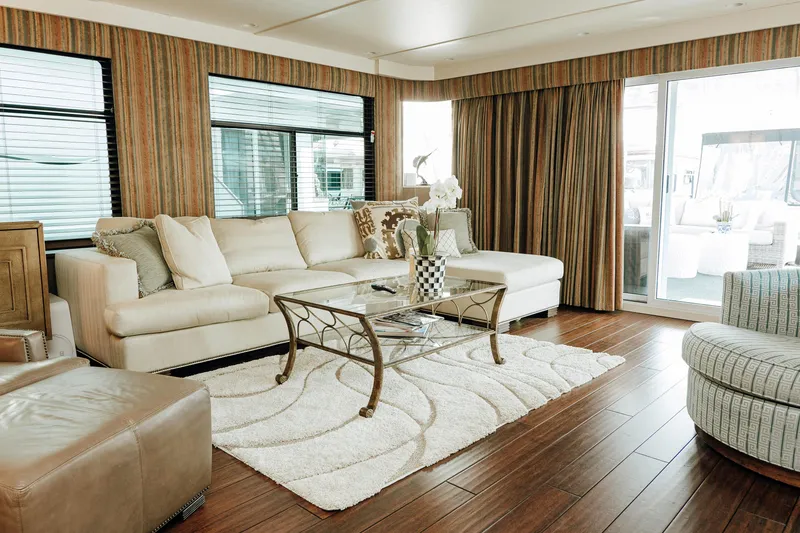 Slide: The Image of Luxurious 1996 Sumerset houseboat interior with elegant living room, plush seating, and stylish decor. - 3