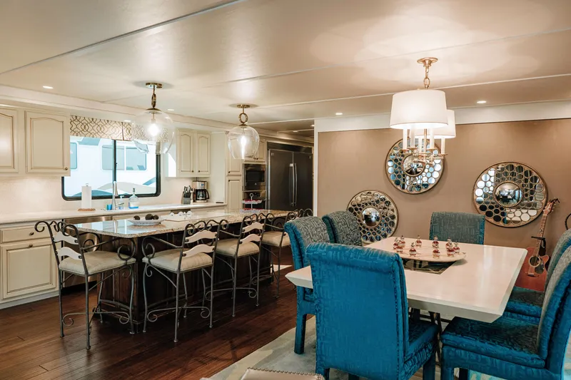 Slide: The Image of Luxurious 1996 Sumerset houseboat interior with elegant dining area and modern kitchen. - 6