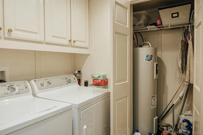 Slide: The Image of Laundry room with washer, dryer, and storage in 1996 Sumerset houseboat. - 9