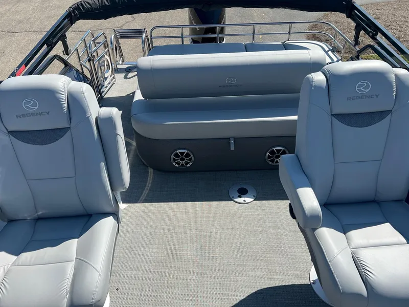 Slide: The Image of 2023 Regency 230 LE3 Sport boat interior with plush seating and modern design. - 2