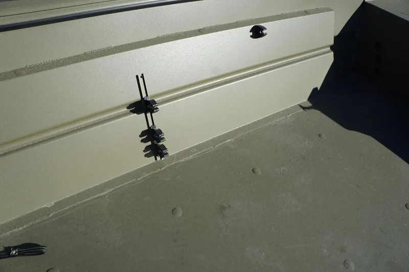 Slide: The Image of 2023 Lowe RX2070 SC boat interior detail with rod holders. - 10