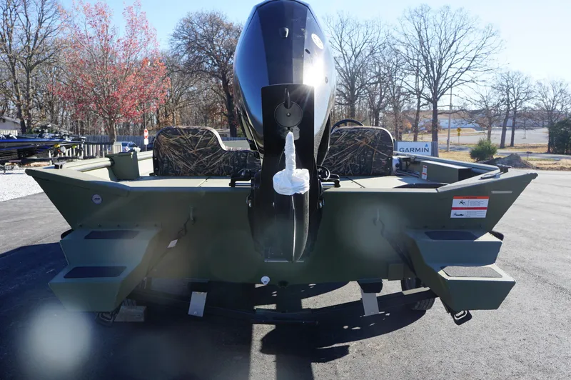 Slide: The Image of 2023 Lowe RX2070 SC boat rear view with outboard motor. - 4