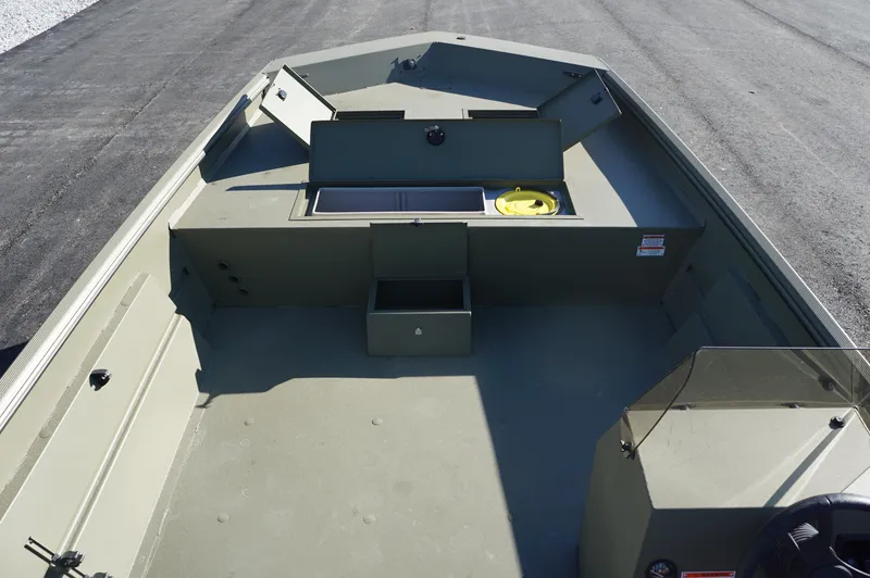 Slide: The Image of 2023 Lowe RX2070 SC boat interior with storage compartments and seating. - 8