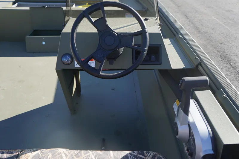 Slide: The Image of 2023 Lowe RX2070 SC boat steering console with control lever and camo seat. - 9