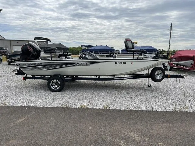 Slide: The Image of 2018 Lowe Stinger 188 fishing boat on trailer, side view. - 4