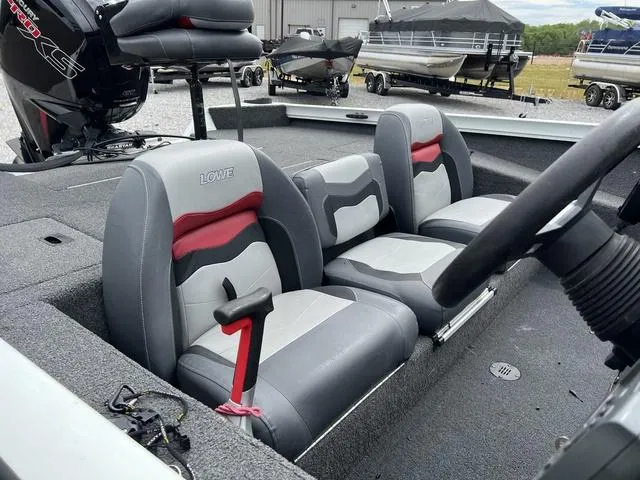 Slide: The Image of 2018 Lowe Stinger 188 boat interior with gray and red seats. - 8