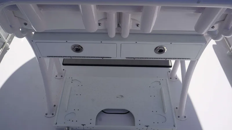 Slide: The Image of 2023 Sportsman 231 Heritage boat console with storage compartments and rod holders. - 10