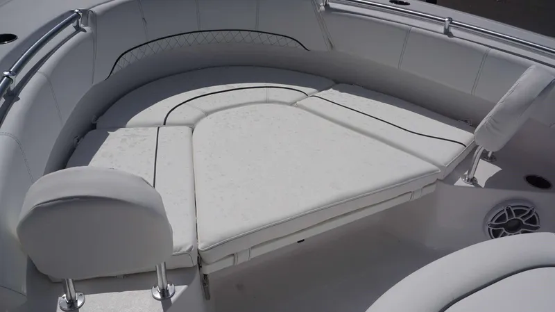 Slide: The Image of 2023 Sportsman 231 Heritage boat with cushioned seating and stainless steel railings. - 13
