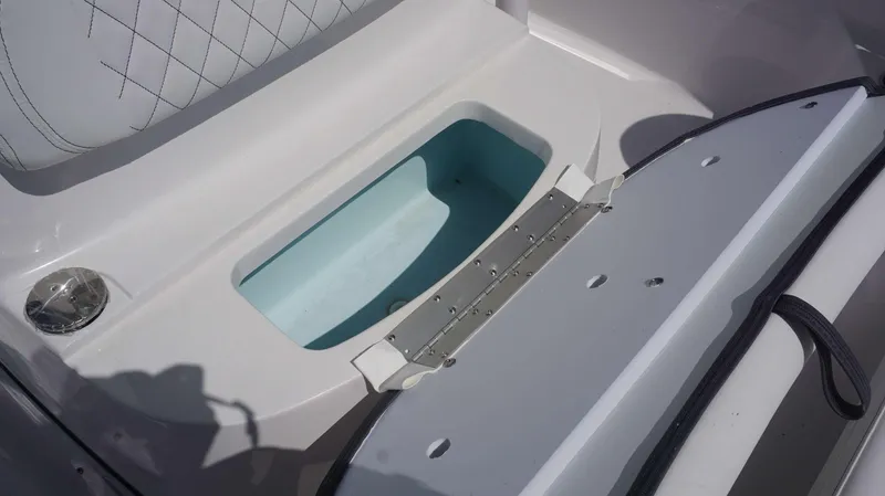 Slide: The Image of 2023 Sportsman 231 Heritage boat storage compartment with cushioned seating. - 16